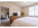 Bedroom with a ceiling fan, bed, dresser, and window at 1941 S Pierpont Dr # 2073, Mesa, AZ 85206