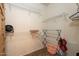 Neutral walk-in closet with wire shelves and closet organizers at 1941 S Pierpont Dr # 2073, Mesa, AZ 85206