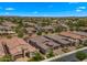 Expansive aerial view of a neighborhood showcasing single-Gathering homes and well-maintained landscaping at 19877 S 185Th Way, Queen Creek, AZ 85142