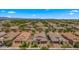 Aerial view of houses in a neighborhood, highlighting well-manicured lawns and mature trees at 19877 S 185Th Way, Queen Creek, AZ 85142