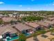 Community aerial view featuring houses with pools and community facilities under a clear blue sky at 19877 S 185Th Way, Queen Creek, AZ 85142