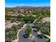 Aerial shot of gated community entry with tree-lined streets and lush landscaping at 19877 S 185Th Way, Queen Creek, AZ 85142
