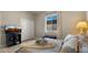 Comfortable bedroom features a TV, soft lighting, and sliding door closet at 19877 S 185Th Way, Queen Creek, AZ 85142