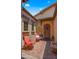 Inviting front porch with seating, decorative rug, and arched doorway, creating a welcoming entrance at 19877 S 185Th Way, Queen Creek, AZ 85142