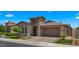 Beautiful single-Gathering home boasts an arched entry, two-car garage and a manicured front yard at 19877 S 185Th Way, Queen Creek, AZ 85142