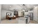 Open-concept kitchen featuring granite countertops, stainless steel appliances, and an island with seating at 19877 S 185Th Way, Queen Creek, AZ 85142