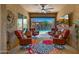 An inviting covered patio with comfortable seating offering great view of the pool and outdoor area at 19877 S 185Th Way, Queen Creek, AZ 85142