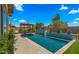 Lovely backyard pool area showcasing a pergola, water feature, and lush landscaping, perfect for outdoor enjoyment at 19877 S 185Th Way, Queen Creek, AZ 85142