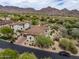Expansive aerial view showcasing an estate home with a beautifully landscaped yard and mountain backdrop at 20055 N 96Th Way, Scottsdale, AZ 85255