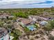 Gorgeous aerial view showcases an estate home with a pool, desert landscaping, and community setting at 20055 N 96Th Way, Scottsdale, AZ 85255