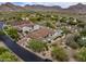 Captivating aerial view of estate home, revealing outdoor living space with desert landscaping and scenic mountains at 20055 N 96Th Way, Scottsdale, AZ 85255