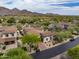 Stunning aerial view of a luxurious estate home with desert landscaping and mountain views at 20055 N 96Th Way, Scottsdale, AZ 85255