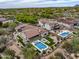 Remarkable aerial view of a sprawling estate featuring a pool, lush landscaping, and multiple outdoor amenities at 20055 N 96Th Way, Scottsdale, AZ 85255
