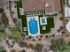 Overhead view of home's backyard showcasing a sparkling pool, jacuzzi, and stylish outdoor seating at 20055 N 96Th Way, Scottsdale, AZ 85255