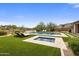 Beautiful backyard oasis with sparkling pool, spa, lush landscaping, and comfortable lounge areas, perfect for relaxation at 20055 N 96Th Way, Scottsdale, AZ 85255