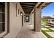 Covered patio with travertine flooring, decorative lights, and outdoor seating, perfect for entertaining at 20055 N 96Th Way, Scottsdale, AZ 85255