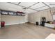Spacious garage featuring ample storage space, epoxy floors, and overhead racks for convenient organization at 20055 N 96Th Way, Scottsdale, AZ 85255