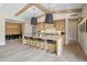 Large kitchen with a spacious island, barstool seating and stainless steel appliances, open to the dining area at 20055 N 96Th Way, Scottsdale, AZ 85255