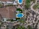 High-angle view showcases a luxurious pool and spa combo amidst beautifully landscaped gardens in a private backyard at 20055 N 96Th Way, Scottsdale, AZ 85255