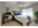 Bedroom featuring ceiling fan, large window, and desk area creating a versatile space at 2020 W Union Hills Dr # 110, Phoenix, AZ 85027
