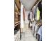 Walk-in closet featuring custom shelving and ample storage for shoes and clothing at 2020 W Union Hills Dr # 110, Phoenix, AZ 85027