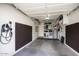 Spacious two-car garage with ample storage space and an electric vehicle charger at 2020 W Union Hills Dr # 110, Phoenix, AZ 85027