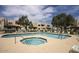 Community pool and spa area surrounded by seating and lush landscaping at 2020 W Union Hills Dr # 110, Phoenix, AZ 85027