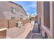 Gravel backyard including a paved walkway, air conditioning, and storage at 21841 N Ingram Ct, Maricopa, AZ 85138