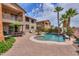 Spacious backyard with pool, mature landscaping, dining area and lounge seating at 21841 N Ingram Ct, Maricopa, AZ 85138