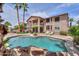 A gorgeous pool with rock features highlights this home's backyard and outdoor living space at 21841 N Ingram Ct, Maricopa, AZ 85138
