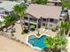 Aerial view of the backyard, including a pool, patio, and balcony perfect for outdoor enjoyment at 21841 N Ingram Ct, Maricopa, AZ 85138