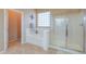 Bright bathroom featuring a separate tub and glass-enclosed shower, offering a spa-like experience at 21841 N Ingram Ct, Maricopa, AZ 85138