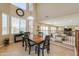 Sunlit breakfast nook with large windows, a view, and adjacent to the open concept living area at 21841 N Ingram Ct, Maricopa, AZ 85138
