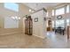 Open-concept dining room with tall ceilings, large windows, and decorative china cabinet at 21841 N Ingram Ct, Maricopa, AZ 85138