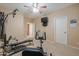 Bright exercise room featuring fitness equipment and a view into the hallway at 21841 N Ingram Ct, Maricopa, AZ 85138