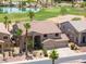 Stunning home with lush landscaping, a three car garage, and a view of the adjacent golf course at 21841 N Ingram Ct, Maricopa, AZ 85138