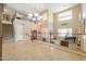 Spacious foyer with second story view of office, living room and large chandelier at 21841 N Ingram Ct, Maricopa, AZ 85138