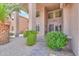 Inviting front entrance with well-manicured landscaping adding beauty to the home's curb appeal at 21841 N Ingram Ct, Maricopa, AZ 85138