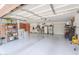 Spacious garage with epoxy floors, ample storage, and plenty of room for three cars at 21841 N Ingram Ct, Maricopa, AZ 85138