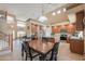 Spacious kitchen with stainless steel appliances, a center island, and adjacent breakfast nook at 21841 N Ingram Ct, Maricopa, AZ 85138