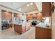 A well-equipped kitchen features an island, stainless appliances, and ample cabinet space for storage at 21841 N Ingram Ct, Maricopa, AZ 85138