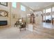Spacious living room with a fireplace, soaring ceilings and beautiful tile and carpet flooring at 21841 N Ingram Ct, Maricopa, AZ 85138