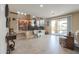 Living room with an open floor plan that seamlessly connects to the kitchen and breakfast nook at 21841 N Ingram Ct, Maricopa, AZ 85138