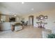 Open-concept living room with natural light, comfortable seating, and stylish decor at 21841 N Ingram Ct, Maricopa, AZ 85138