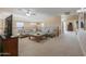 Cozy loft area with plush seating, neutral tones, and a ceiling fan at 21841 N Ingram Ct, Maricopa, AZ 85138