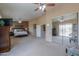 Open main bedroom featuring large windows, plush carpeting, and dark wood furnishings for a luxurious feel at 21841 N Ingram Ct, Maricopa, AZ 85138