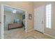 Home office with neutral walls, tile flooring, and a modern desk setup at 21841 N Ingram Ct, Maricopa, AZ 85138