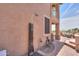 Backyard outdoor shower surrounded by paved bricks and stucco siding at 21841 N Ingram Ct, Maricopa, AZ 85138