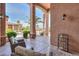 Covered outdoor patio with comfortable seating providing a relaxing and inviting space at 21841 N Ingram Ct, Maricopa, AZ 85138