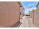 Paver side yard leading to backyard, outdoor storage and other home features at 21841 N Ingram Ct, Maricopa, AZ 85138